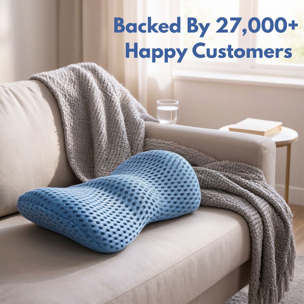 Blue lumbar support pillow with 3D mesh cover resting on a beige sofa with text overlay "Backed By 27,000+ Happy Customers