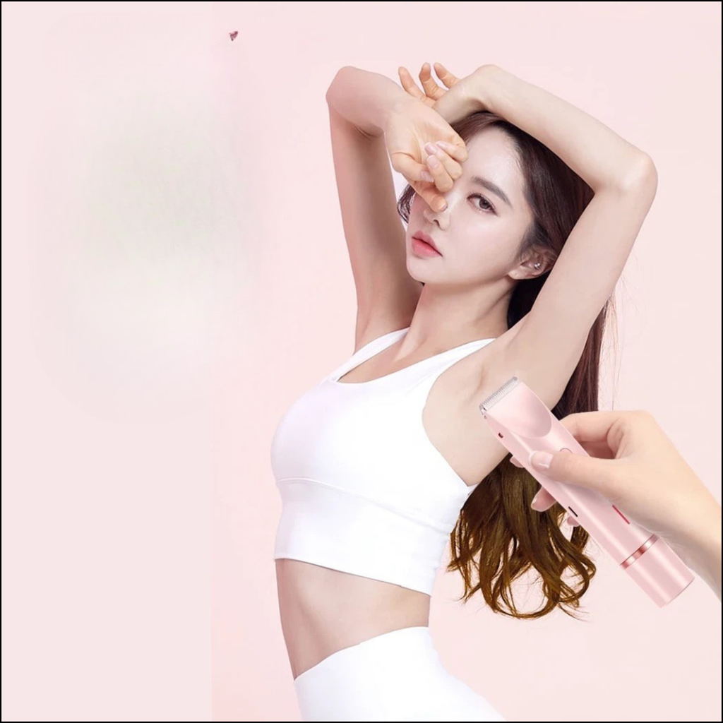 Woman in white sportswear raising arms with pink intimate bikini shaver being applied to underarm area