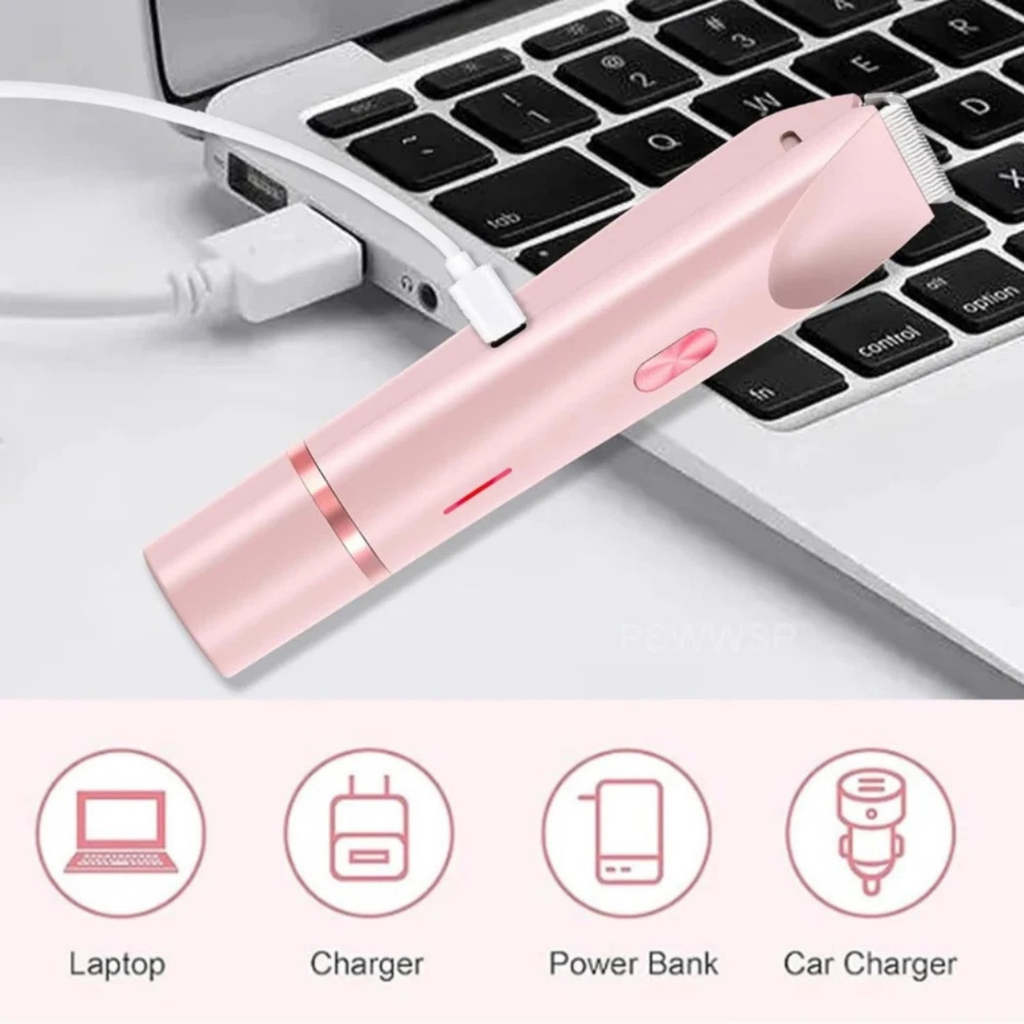 Pink electronic device being charged by a laptop on a white surface