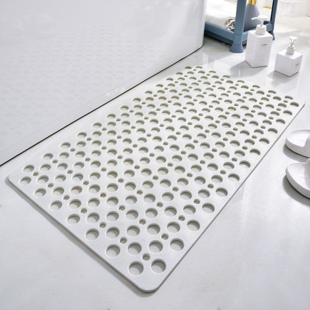 White antibacterial suction shower mat with drainage holes in a clean bathroom setting

